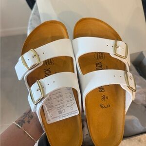 Birkenstock Arizona White Sandals with Gold Accents